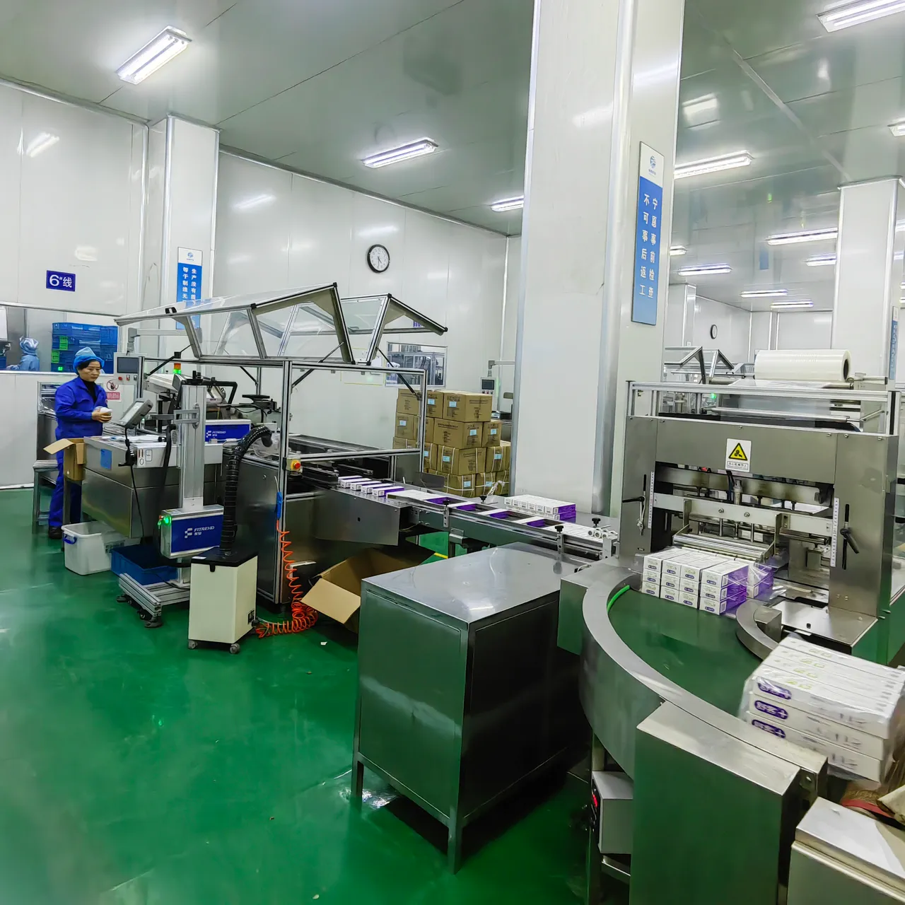 Stainless-steel production vessels on a GMP oral-care manufacturing floor